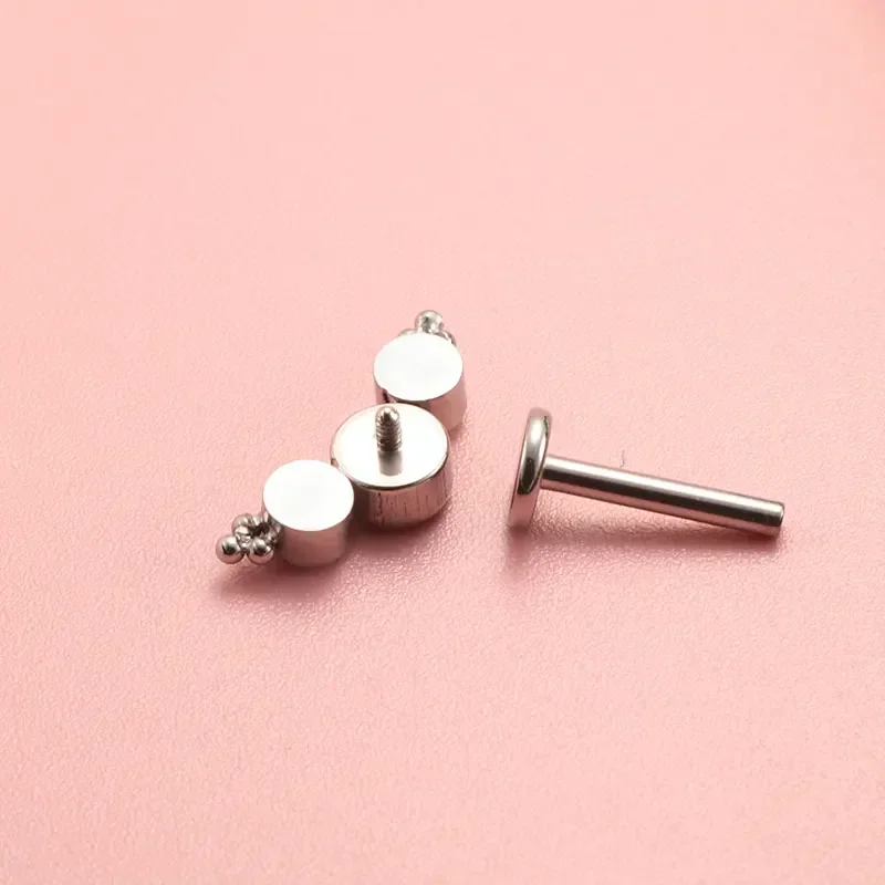 ASTM F136 Titanium Piercing 16 - مراجعة Cluster Stud Ear وسعره